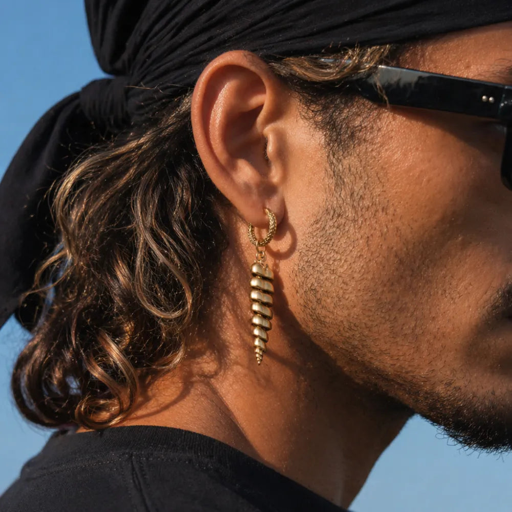 Man wearing Rattlesnake Tail earrings in a side view