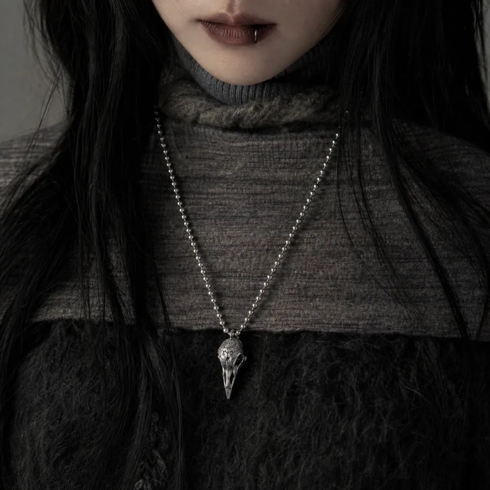 Woman wearing the White Bronze Raven Skull Pendant