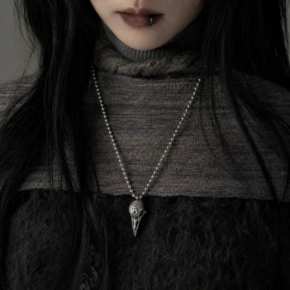 Woman wearing the White Bronze Raven Skull Pendant