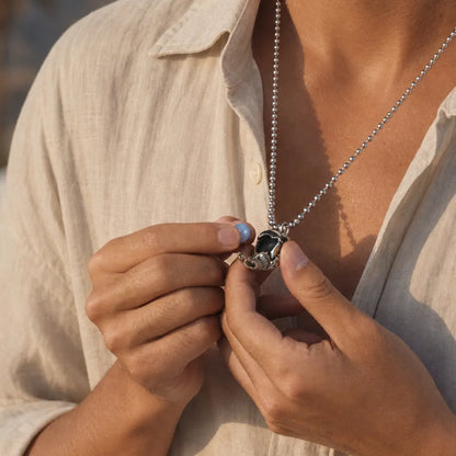 Woman opening the White Bronze Scarab Pendant