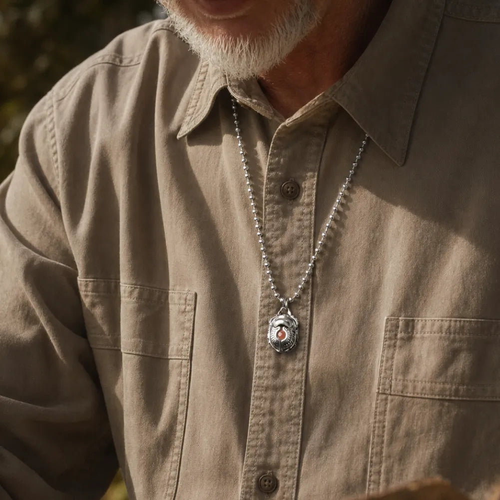 Man wearing the Scarab Pendant with a button-up shirt