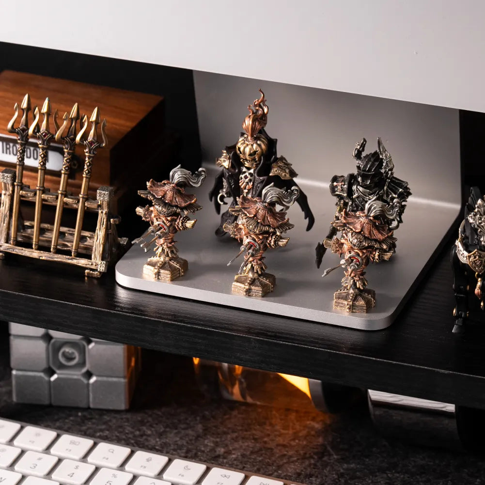 Scarecrow Training Dummy collectible displayed with metal warrior figurines
