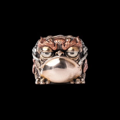 Seven-Star Money Toad figurine on a black background
