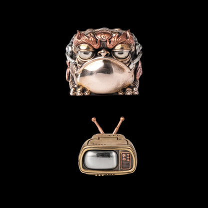 Seven-Star Money Toad figurine with a television base on a black background