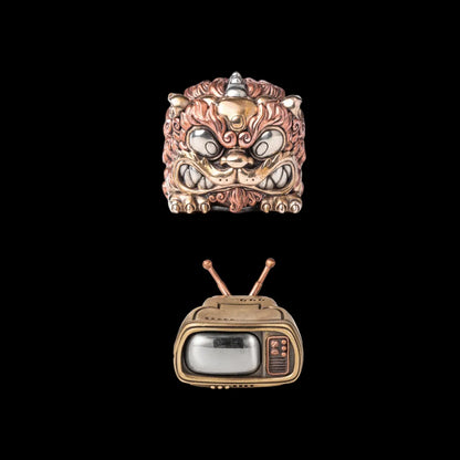 Winged Pixiu figurine with a television base on a black background