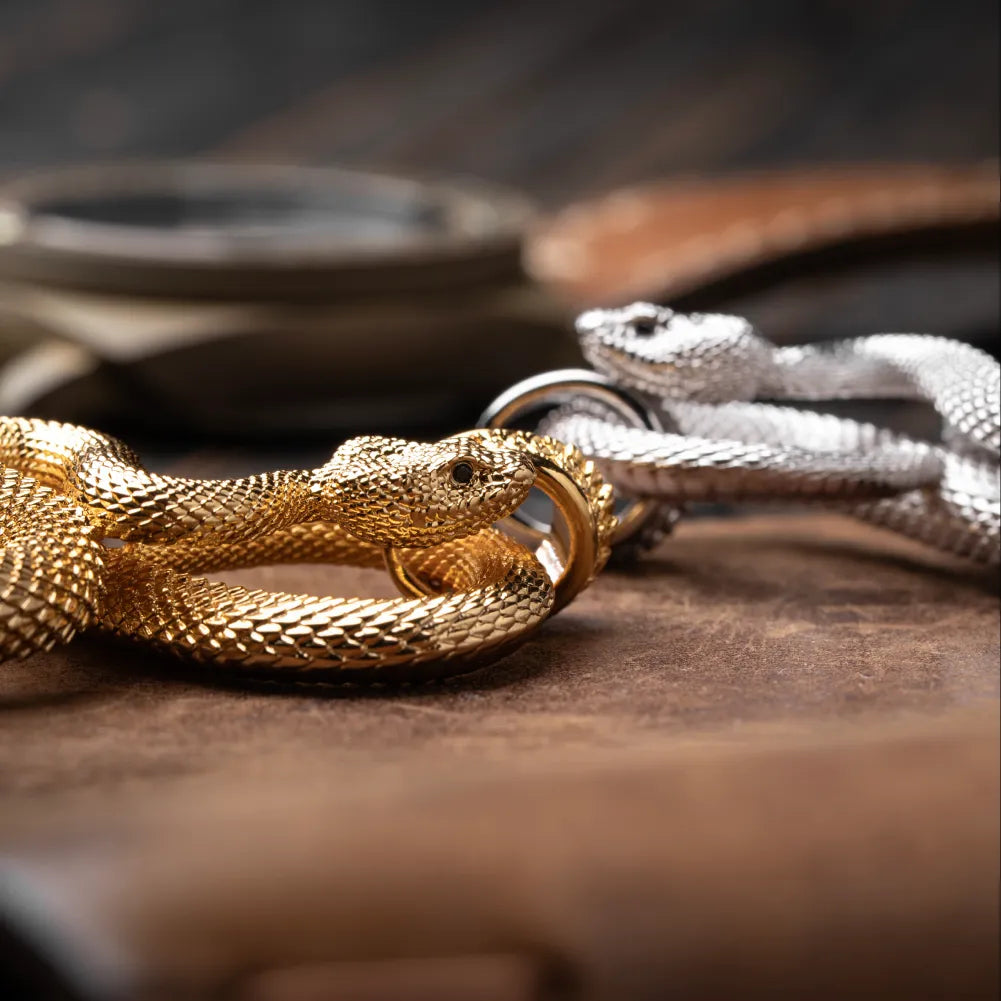 Snake Keychain in 24K Gold Plated Brass, multiple finish variants arranged in a product display.