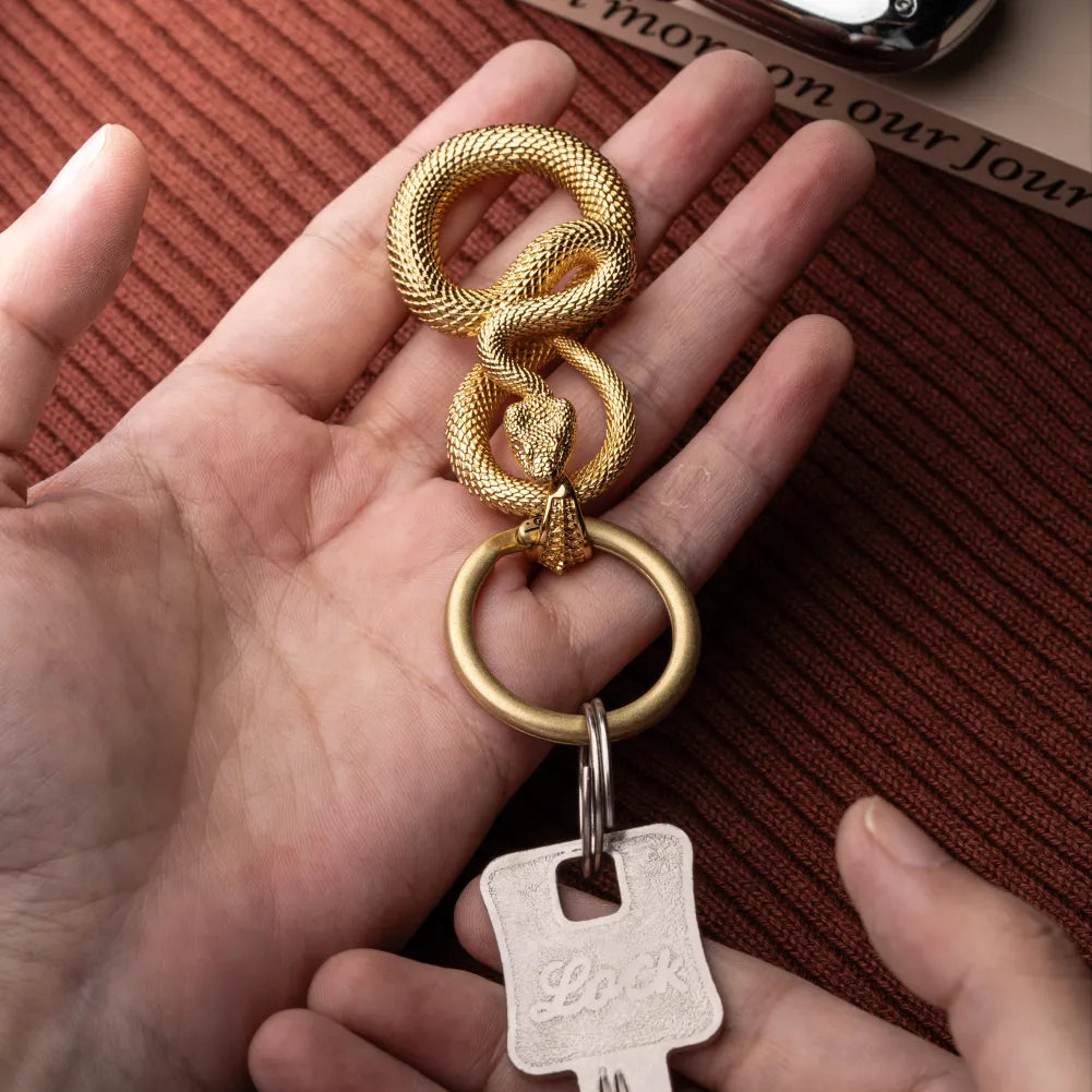 Snake Keychain in 24K Gold Plated Brass, shown with keys in a close product flat lay.