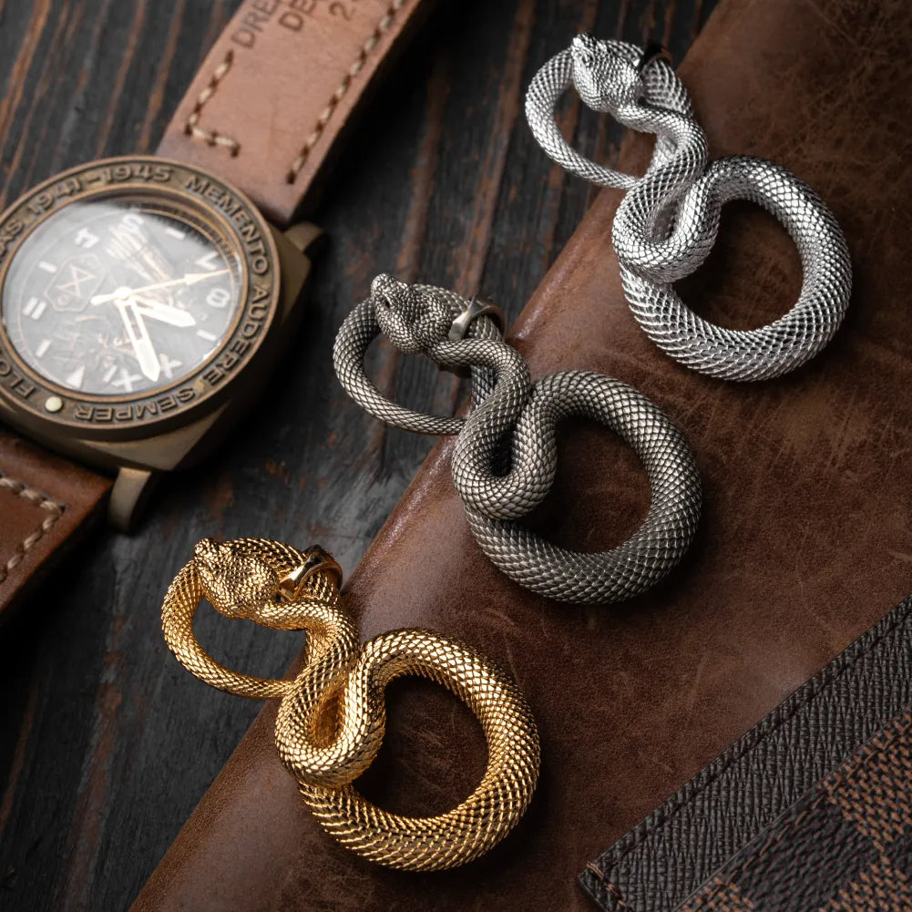 Snake Keychain in White Bronze, multiple finish variants arranged in a product display.