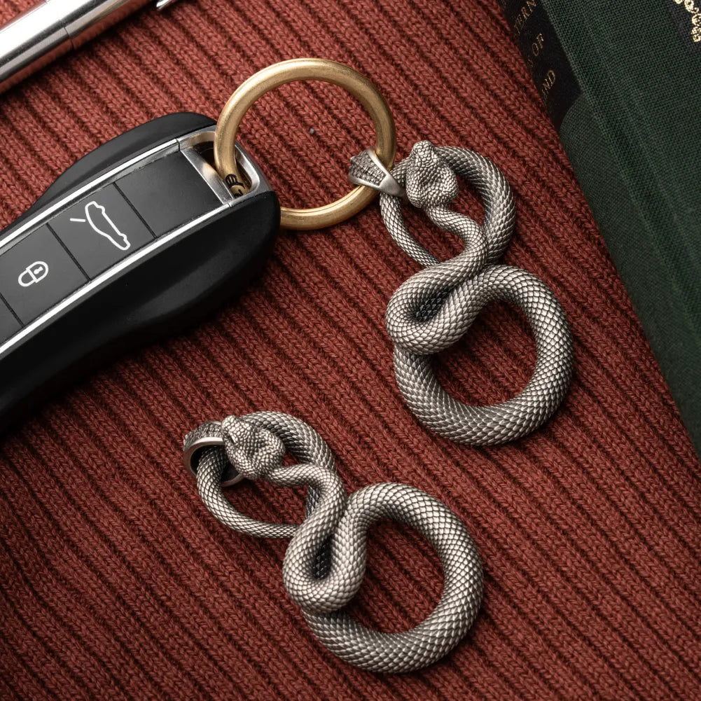 Snake Keychain in White Bronze, shown with keys in a close product flat lay.