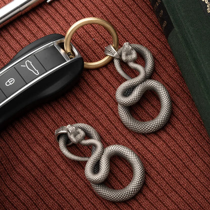 Snake Keychain in White Bronze, shown with keys in a close product flat lay.