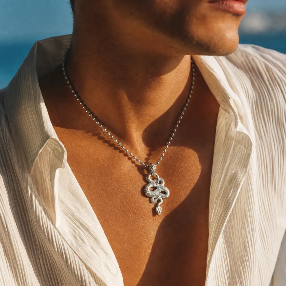 Snake Pendant in 18K White Gold Plated White Bronze, worn by a man in a lifestyle chest view.