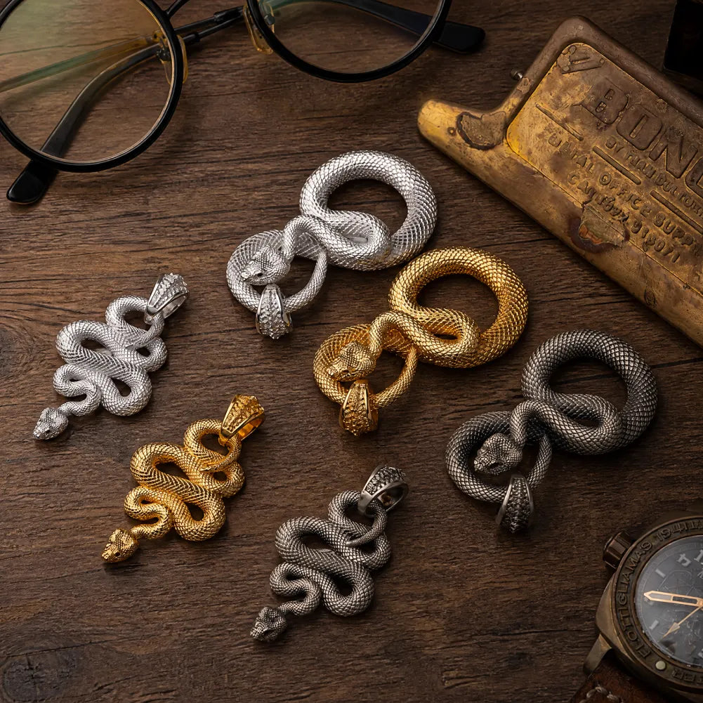 Snake Pendant in White Bronze, multiple finishes arranged in a flat-lay comparison.