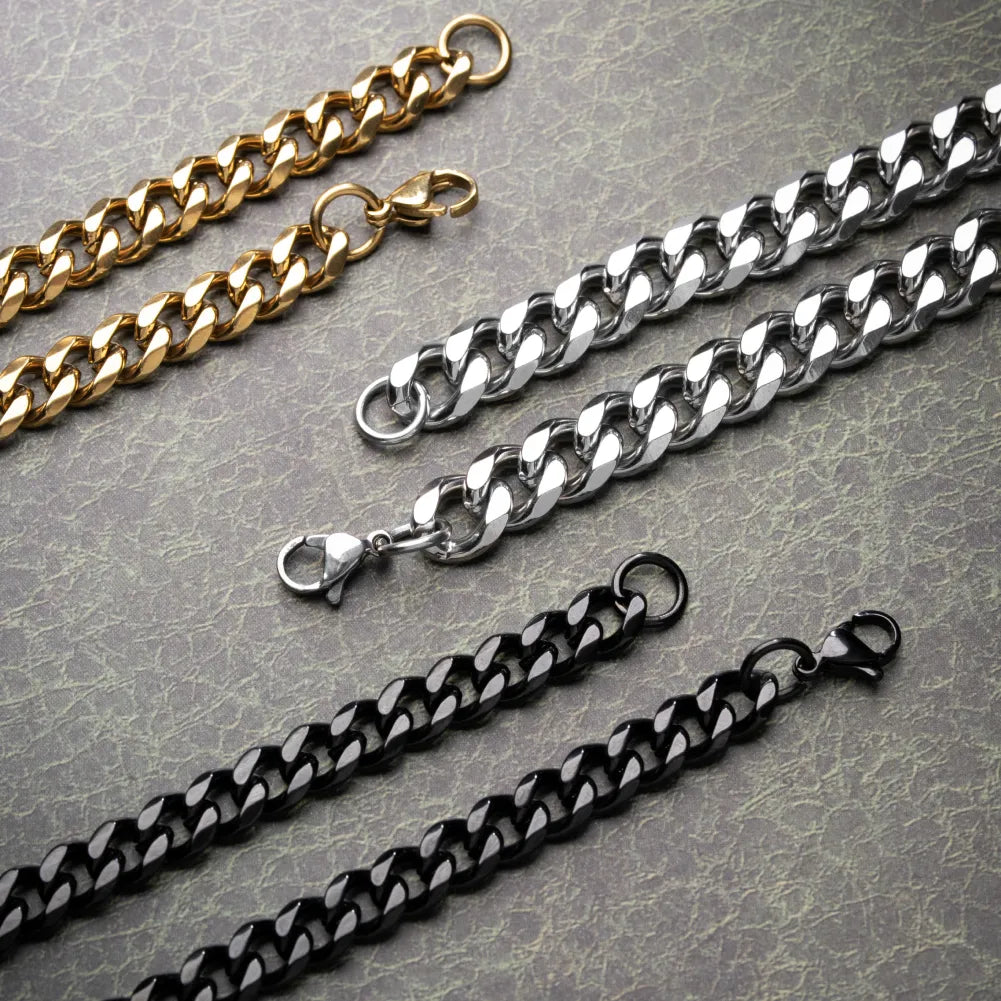 Close-up of Cuban chain links and lobster clasps in gold color, original color and black