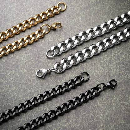 Close-up of Cuban chain links and lobster clasps in gold color, original color and black