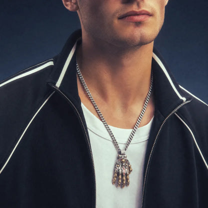 Taoist Mechanical Hand Pendant worn with a black shirt