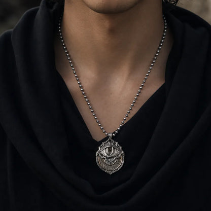 Close view of the Tarot Vision Pendant held by hand