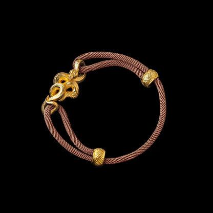Tree Boa rope bracelet in 24K Gold Plated Brass with 4mm Milan Rope and Apricot cord, black-background variant view
