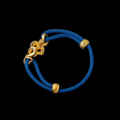 Tree Boa rope bracelet in 24K Gold Plated Brass with 4mm Milan Rope and Indigo cord, black-background variant view