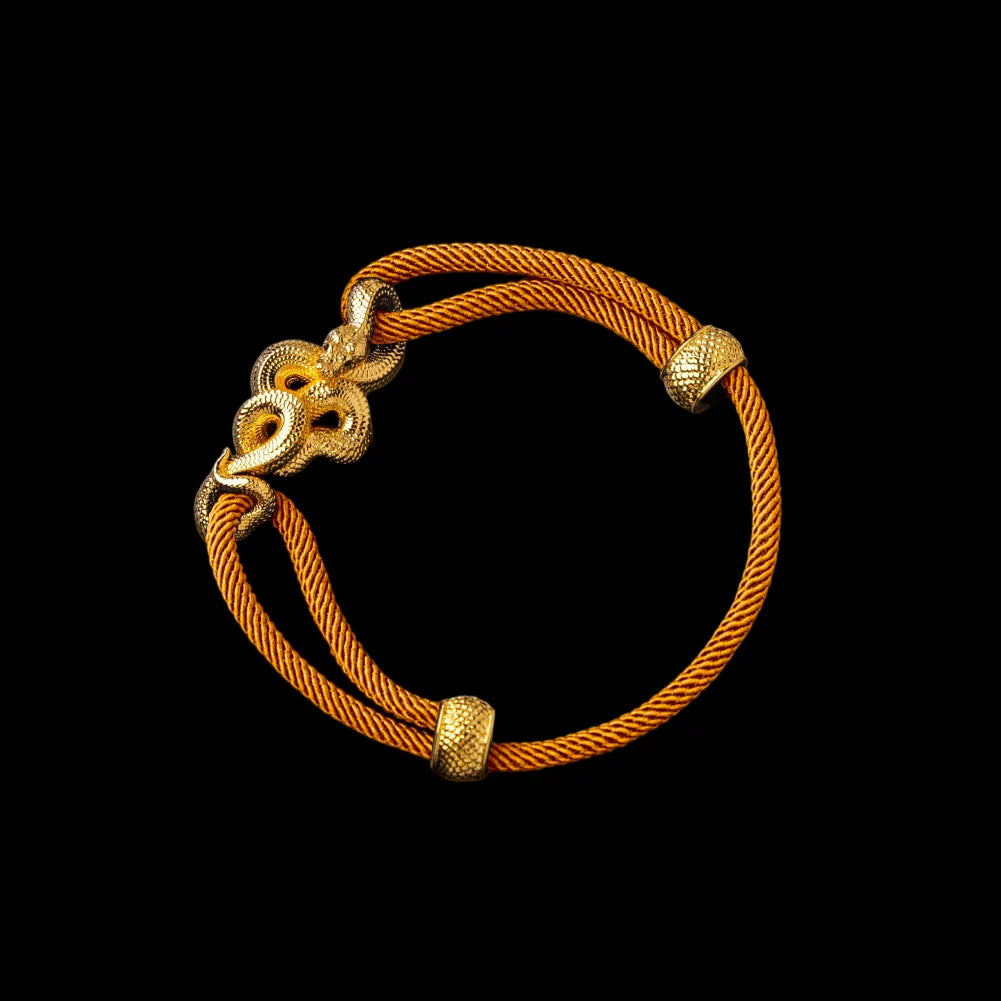 Tree Boa rope bracelet in 24K Gold Plated Brass with 4mm Milan Rope and Ochre cord, black-background variant view