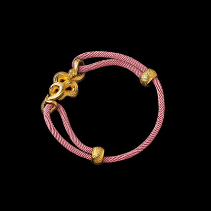 Tree Boa rope bracelet in 24K Gold Plated Brass with 4mm Milan Rope and Strawberry Cream cord, black-background variant view