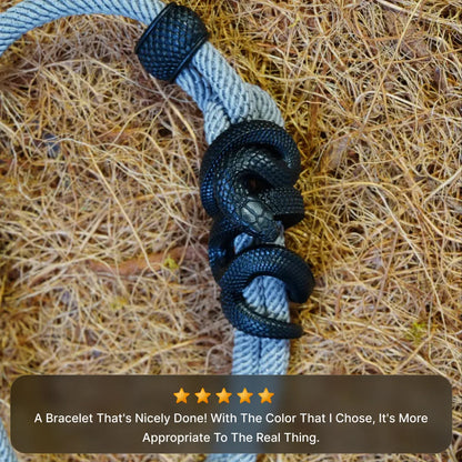 Blackened Tree Boa rope bracelet photographed in an outdoor lifestyle setting
