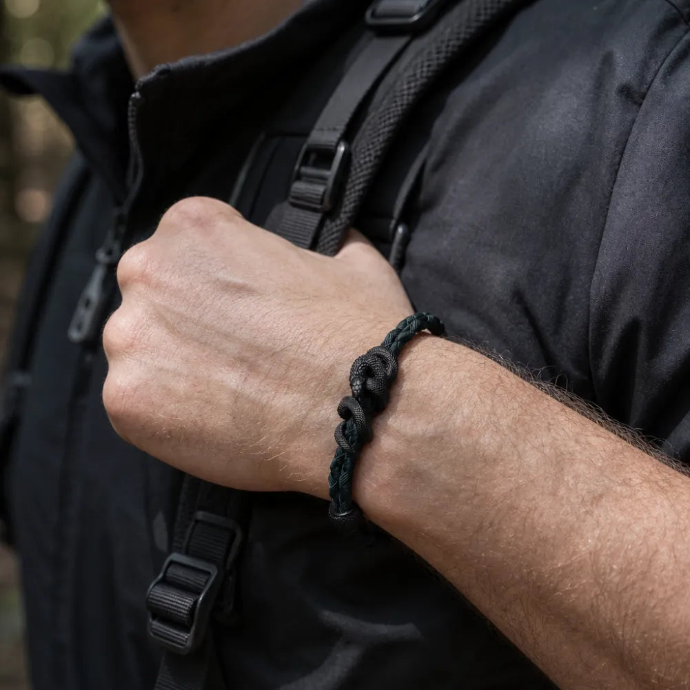 Blackened Tree Boa rope bracelet worn outdoors by a man