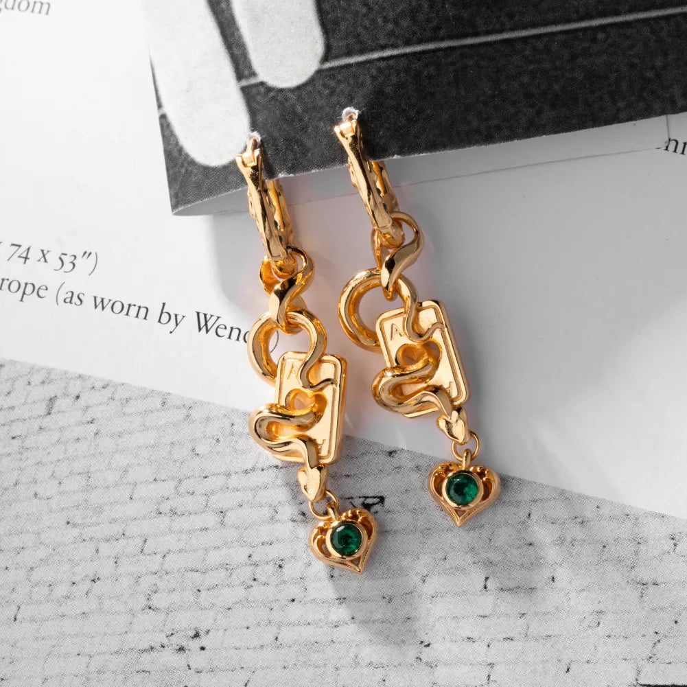 Wild Card Earrings gold-finish pair flat lay
