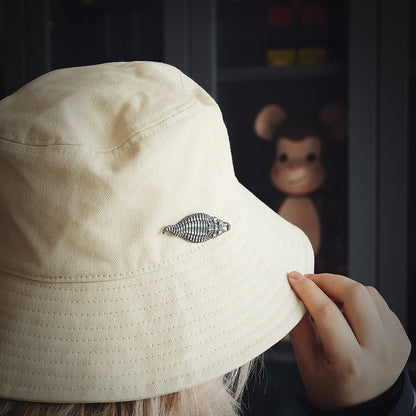 Hat with a Silver Crocodile Brooch